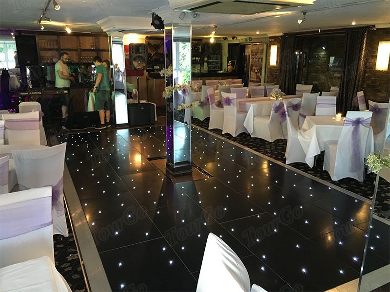 TourGo mobile removable 20ft x 18ft black portable twinkling dance floor for wedding event